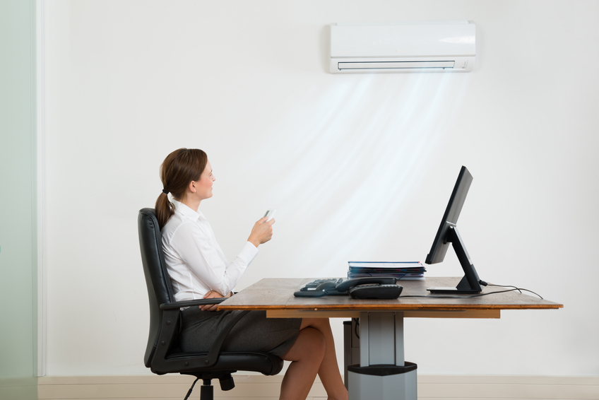Portable air conditioning units set up in a modern office environment