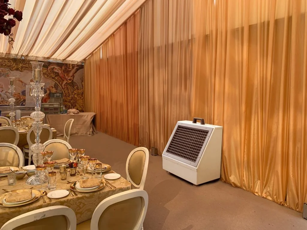 On-site engineer overseeing temporary cooling setup for wedding event